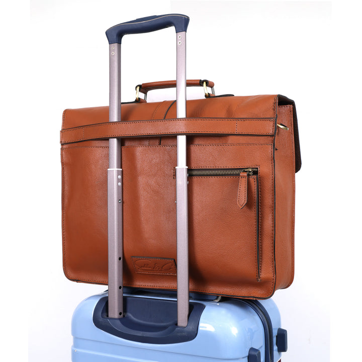 Brown leather suitcase with wheels on a white background