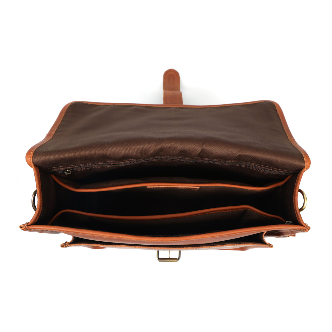 Brown leather bag with open interior on a white background