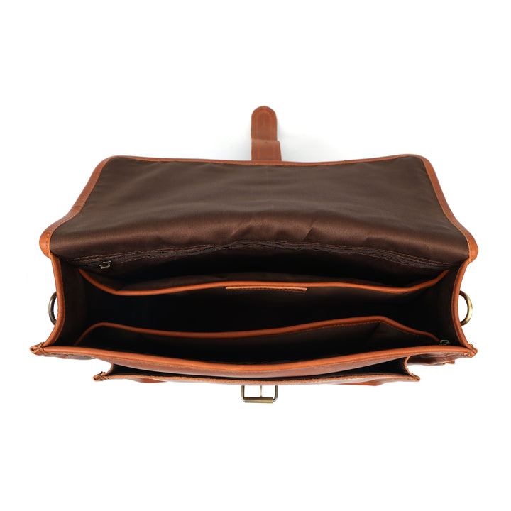 Brown leather bag with open interior on a white background