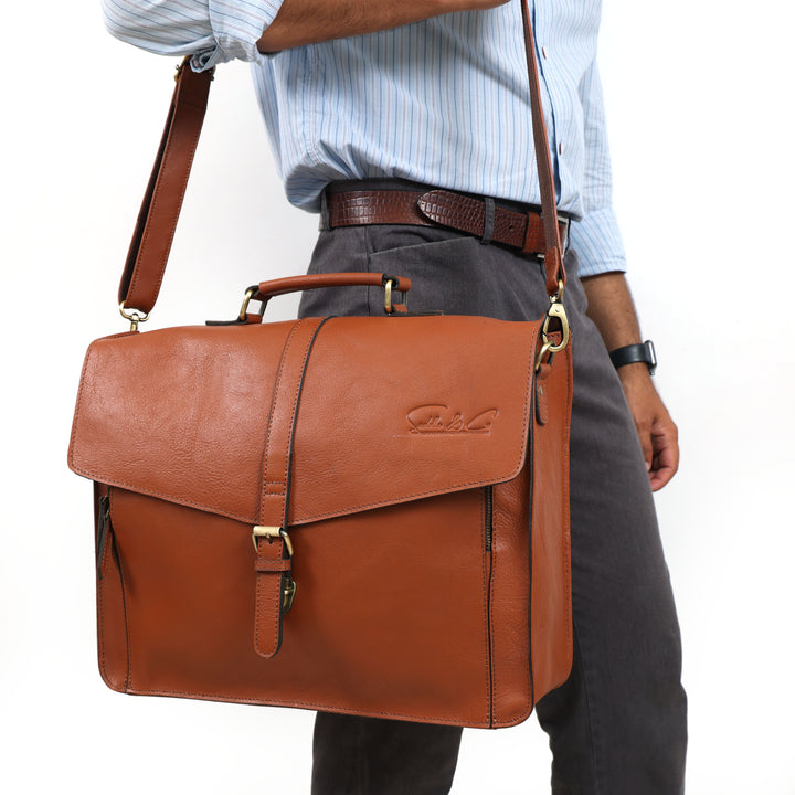 Brown leather briefcase carried by a person on a white background