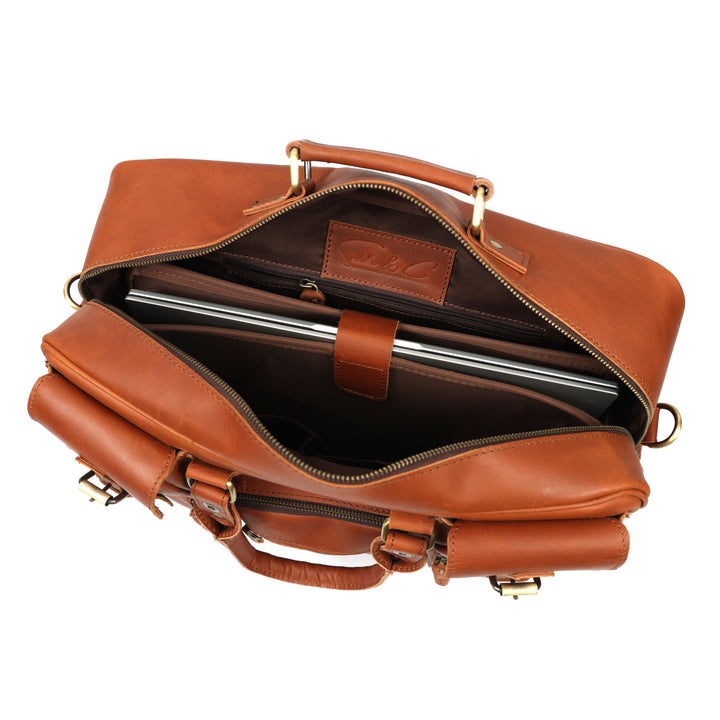 Brown leather briefcase with a laptop inside on a white background