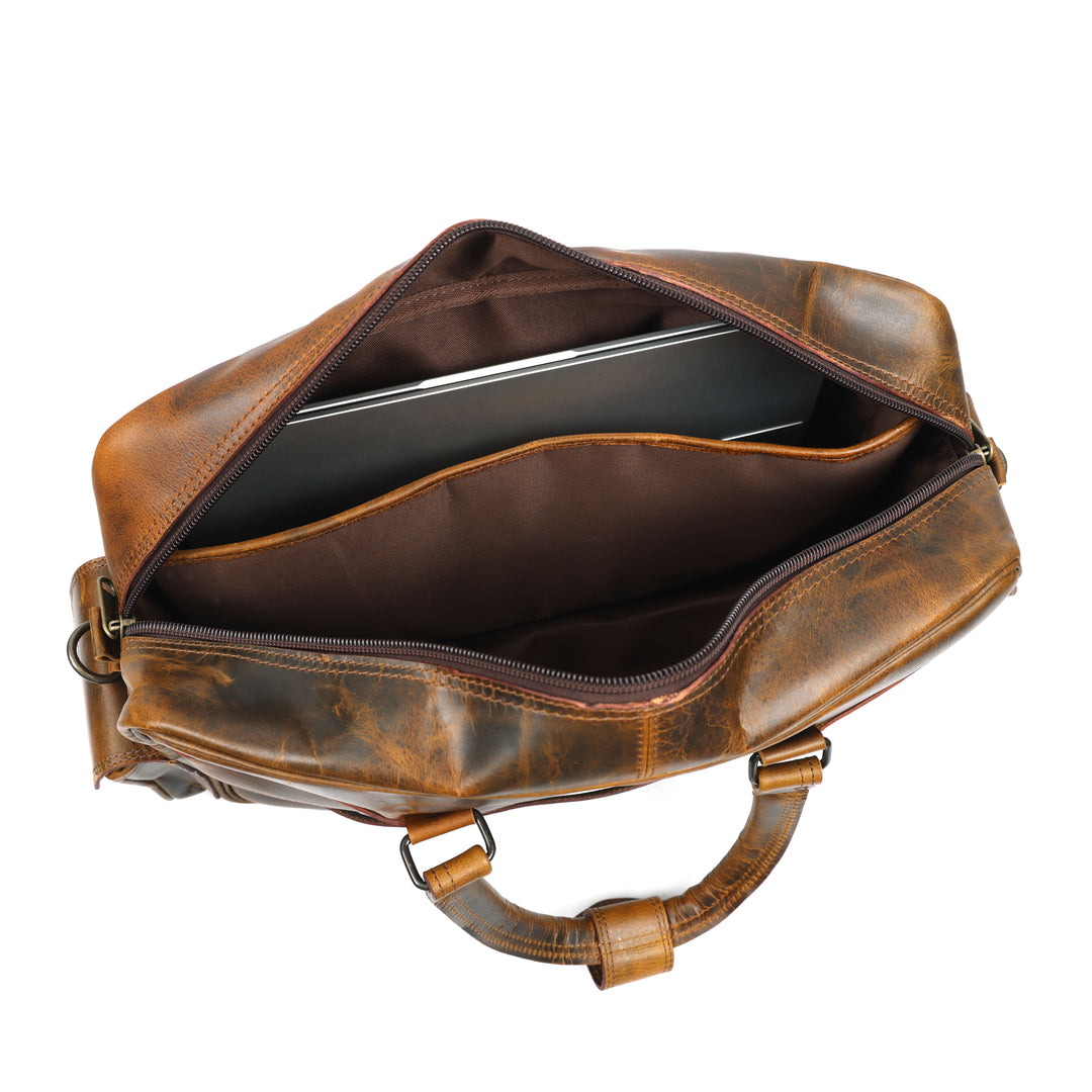 Brown leather bag with a laptop inside on a white background