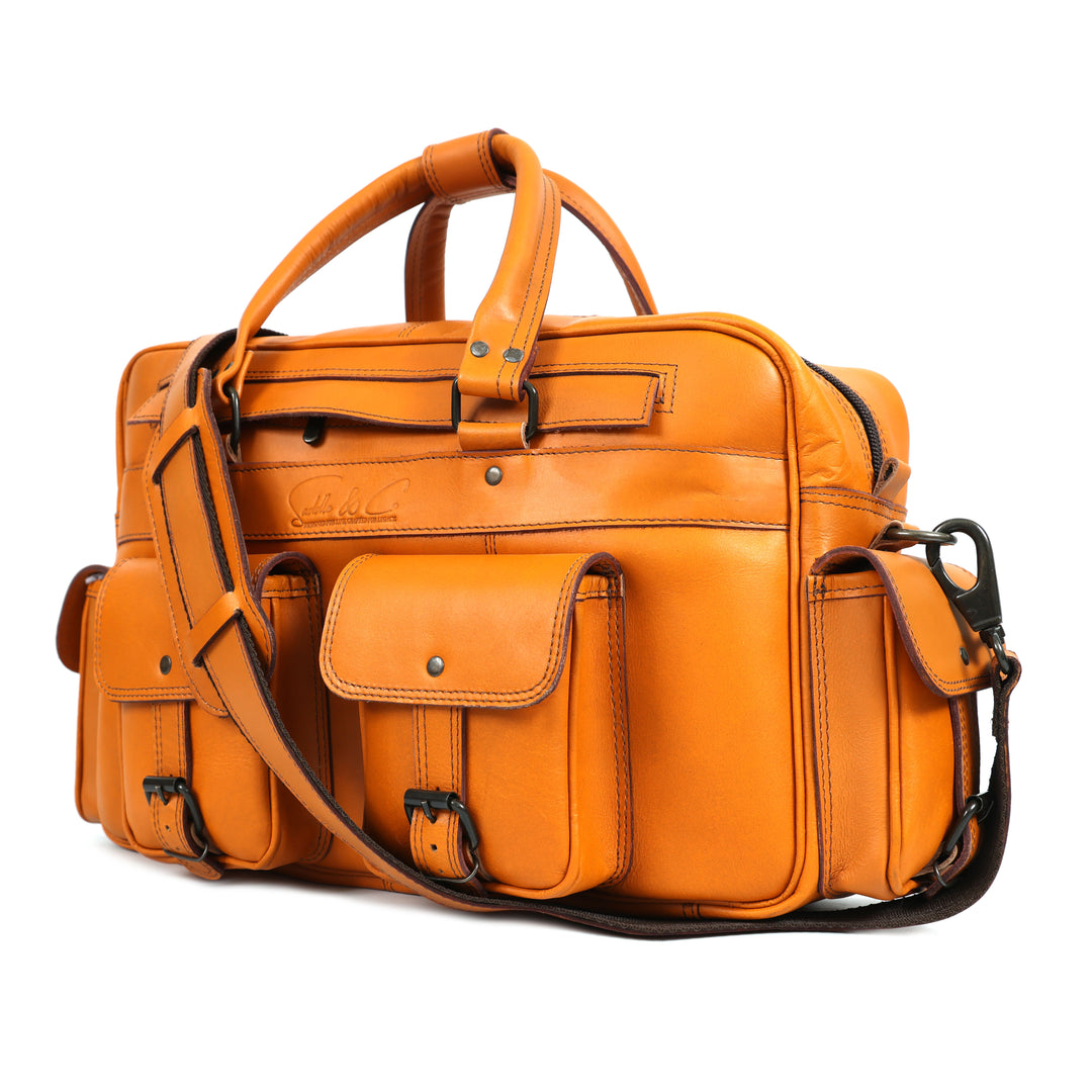 Orange leather bag with a shoulder strap on a white background