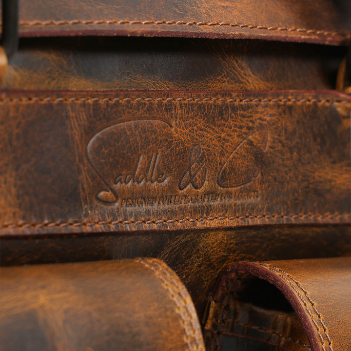 Close-up of a brown leather product with visible branding.