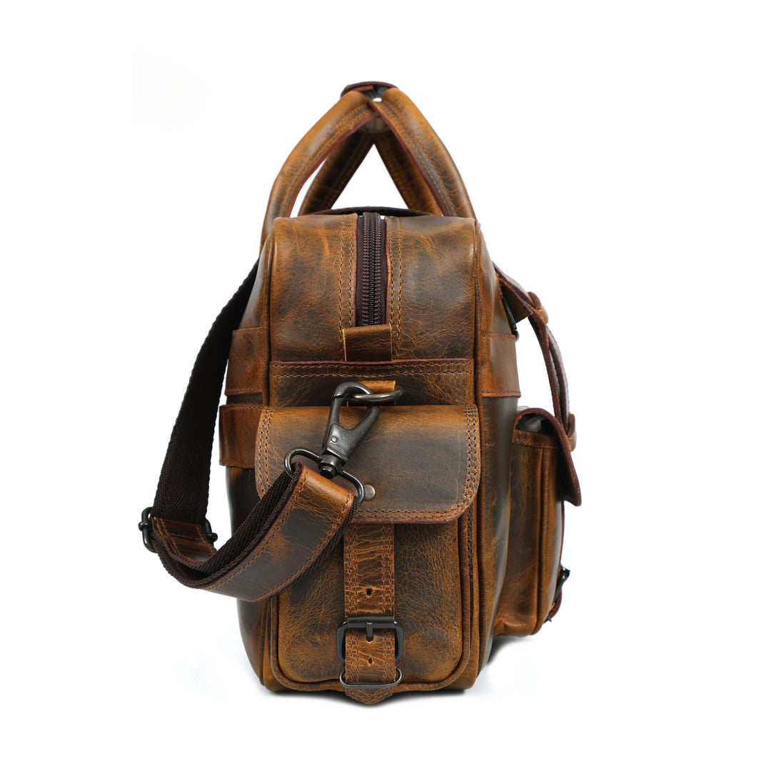 Brown leather bag with a strap on a white background