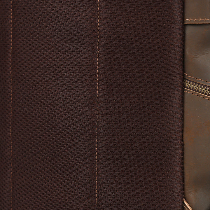 Close-up of brown leather texture with stitching detail