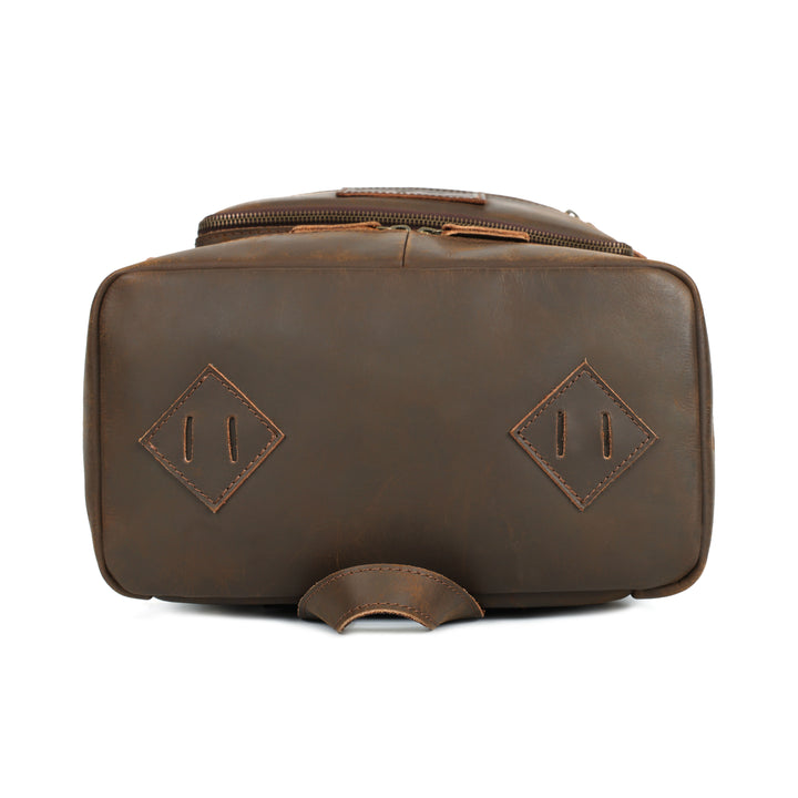 Brown leather toiletry bag with diamond patterns on a white background